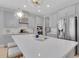 Bright kitchen with a large island, stainless steel refrigerator, and modern fixtures for meal prep and entertaining at 2679 Ridgetop Ln, Clermont, FL 34711