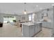 Open-concept kitchen featuring a center island, modern appliances, and a seamless flow to the dining and living areas at 2679 Ridgetop Ln, Clermont, FL 34711
