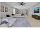 Open floor plan showcasing living room, kitchen, and dining areas with natural light and hardwood flooring at 2679 Ridgetop Ln, Clermont, FL 34711