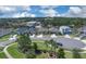 Scenic street view of a residential neighborhood with neatly lined homes and green spaces at 2679 Ridgetop Ln, Clermont, FL 34711