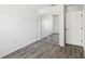 Bedroom with wood-look floors, sliding closet and white door at 2826 Club Cortile Cir # B, Kissimmee, FL 34746