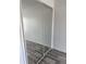 Bedroom with mirrored closet doors and neutral gray vinyl plank flooring at 2826 Club Cortile Cir # B, Kissimmee, FL 34746