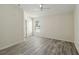 Bedroom with ceiling fan, wood-look floors, and natural light at 2826 Club Cortile Cir # B, Kissimmee, FL 34746