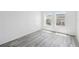Bright bedroom with modern wood-look flooring and plenty of natural light at 2826 Club Cortile Cir # B, Kissimmee, FL 34746