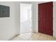 Entryway with a red front door that leads to a bright, airy living space at 2826 Club Cortile Cir # B, Kissimmee, FL 34746