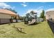 Community playground featuring green turf and several climbing and sliding structures at 2826 Club Cortile Cir # B, Kissimmee, FL 34746