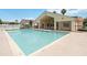 Community pool with clubhouse, shallow end, and lounge chairs at 2826 Club Cortile Cir # B, Kissimmee, FL 34746