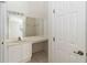 A well-lit vanity space with a sink, mirror and counter space at 2826 Club Cortile Cir # B, Kissimmee, FL 34746