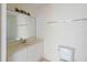 Neutral bathroom includes a vanity with a large mirror and a shower/tub at 2828 Club Cortile Cir # B, Kissimmee, FL 34746