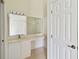 The bathroom vanity offers ample lighting and vanity space at 2828 Club Cortile Cir # B, Kissimmee, FL 34746