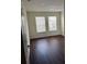 Bedroom with wood floors and lots of natural light at 2828 Club Cortile Cir # B, Kissimmee, FL 34746