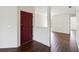 Inviting entryway with dark wood floors and red door at 2828 Club Cortile Cir # B, Kissimmee, FL 34746