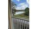 View of the lake and walking path from the balcony at 2828 Club Cortile Cir # B, Kissimmee, FL 34746