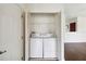 Convenient laundry closet includes a washer and dryer at 2828 Club Cortile Cir # B, Kissimmee, FL 34746