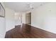 Bright living room features sleek wood floors and ceiling fan at 2828 Club Cortile Cir # B, Kissimmee, FL 34746