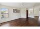 Living room features dark wood floors and lots of sunlight at 2828 Club Cortile Cir # B, Kissimmee, FL 34746