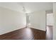 Bright living room features dark wood floors, and a classic chandelier at 2828 Club Cortile Cir # B, Kissimmee, FL 34746
