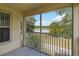 Enclosed patio showcases beautiful views of the lake and trees at 2828 Club Cortile Cir # B, Kissimmee, FL 34746