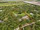 Expansive property outlined in red, featuring a pond and surrounded by a dense canopy of trees for seclusion at 2851 Wagon Ct, St Cloud, FL 34772