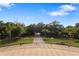 Scenic view from a balcony overlooking lush greenery, trees, and landscaped grounds at 2851 Wagon Ct, St Cloud, FL 34772