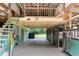 Spacious barn interior featuring horse stalls and a well-lit, open design with wooden accents at 2851 Wagon Ct, St Cloud, FL 34772