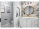 Stylish powder room with a modern vanity, chic wallpaper, and modern fixtures at 2851 Wagon Ct, St Cloud, FL 34772