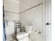 Well-lit bathroom offers tiled walls, modern toilet, and sleek hardware for a spa-like experience at 2851 Wagon Ct, St Cloud, FL 34772