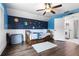 Fun bedroom with a celestial mural, wood-look floors, and a ceiling fan at 2851 Wagon Ct, St Cloud, FL 34772