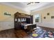 Fun ' bedroom featuring a bunk bed and a playful space-themed rug at 2851 Wagon Ct, St Cloud, FL 34772