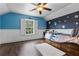 Charming bedroom featuring colorful decor, and wood-look floors at 2851 Wagon Ct, St Cloud, FL 34772