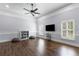 Spacious bonus room featuring hardwood floors, modern lighting, and a ceiling fan, creating a versatile space at 2851 Wagon Ct, St Cloud, FL 34772