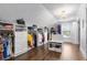 Large walk-in closet with custom shelving, drawers, and a chandelier at 2851 Wagon Ct, St Cloud, FL 34772