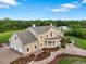 Elegant estate featuring a three-car garage, manicured landscaping, and a welcoming front entrance at 2851 Wagon Ct, St Cloud, FL 34772