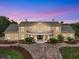 Grand estate with an inviting balcony and beautifully landscaped front yard, perfect for elegant outdoor living at 2851 Wagon Ct, St Cloud, FL 34772