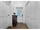 Hallway with dark wood-look floors, shoe rack, and closet at 2851 Wagon Ct, St Cloud, FL 34772