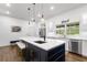 Open kitchen with a spacious island, modern appliances, and natural light at 2851 Wagon Ct, St Cloud, FL 34772
