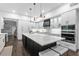 Bright kitchen features a large island with seating and modern appliances at 2851 Wagon Ct, St Cloud, FL 34772