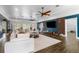 Spacious living room with dark wood flooring, modern furniture, and accent wall at 2851 Wagon Ct, St Cloud, FL 34772