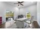 Bright home office with large windows, modern desk, and access to patio at 2851 Wagon Ct, St Cloud, FL 34772