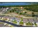 Beautiful community aerial view featuring a lake, and a community pool close to well maintained homes at 3053 Royal Tern Dr, Winter Haven, FL 33881