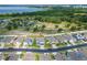 An aerial view of a well-kept neighborhood that is near a lake and a community pool at 3053 Royal Tern Dr, Winter Haven, FL 33881