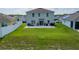 Expansive backyard features a well-maintained lawn and a cozy patio, perfect for outdoor relaxation and entertaining at 3053 Royal Tern Dr, Winter Haven, FL 33881