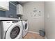 Well-equipped laundry room with modern washer and dryer for convenient chores at 3053 Royal Tern Dr, Winter Haven, FL 33881