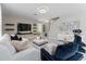 Cozy living room with stylish furnishings, modern decor, and lots of natural light at 3053 Royal Tern Dr, Winter Haven, FL 33881