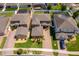 Aerial shot showcases the home's layout, brick driveway, landscaping, and proximity to neighboring houses at 3159 Somerset Park Dr, Orlando, FL 32824