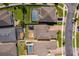 Aerial view shows the home's position on the street, the brick driveway, and nearby community features at 3159 Somerset Park Dr, Orlando, FL 32824