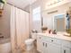 Charming bathroom with neutral colors, tub-shower combination, and vanity storage at 3159 Somerset Park Dr, Orlando, FL 32824