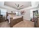 Spacious bedroom featuring a tray ceiling, ceiling fan, and carpeted floor at 3159 Somerset Park Dr, Orlando, FL 32824