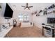 Cozy bedroom/office with natural light, modern decor, ceiling fan, and carpet at 3159 Somerset Park Dr, Orlando, FL 32824