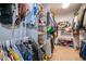 Well-organized closet with ample storage space and a variety of clothing items at 3159 Somerset Park Dr, Orlando, FL 32824